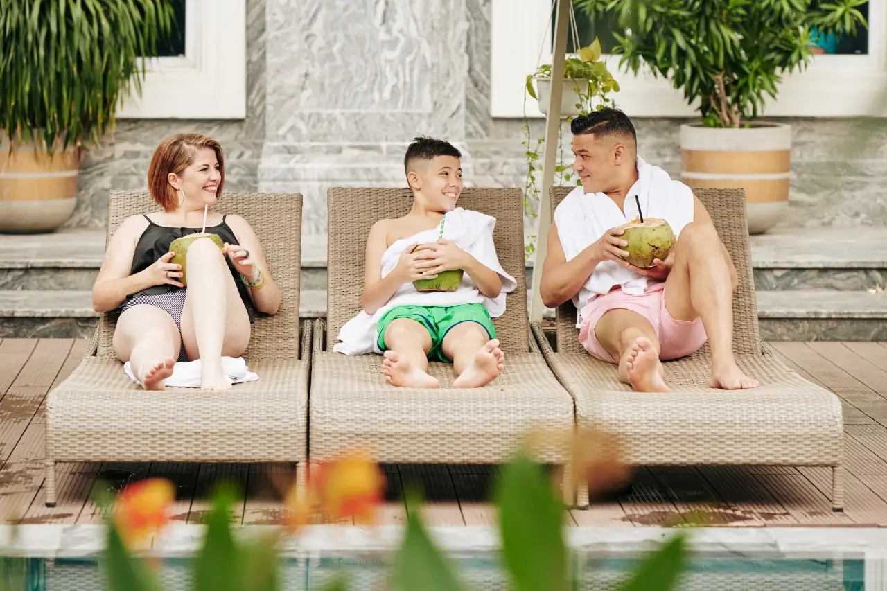 happy-family-relaxing-on-chaise-lounges-family-accommodation-bali